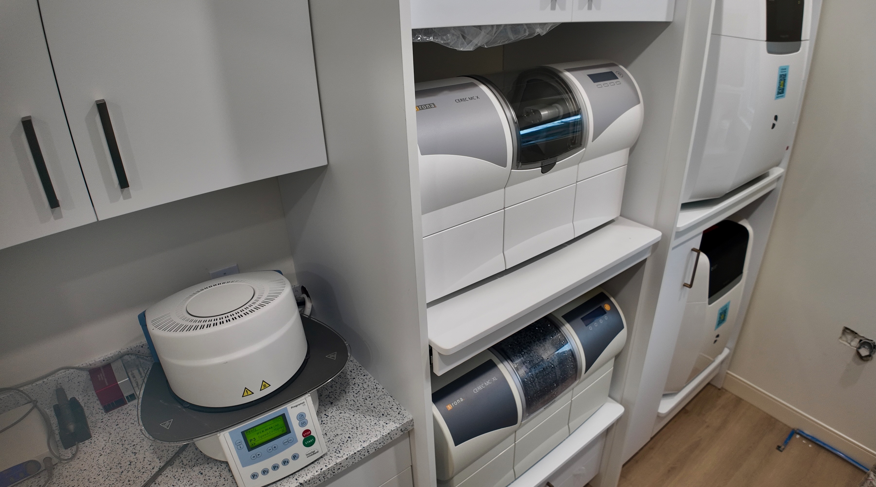 In-house restorative equipment area with milling and finishing units.